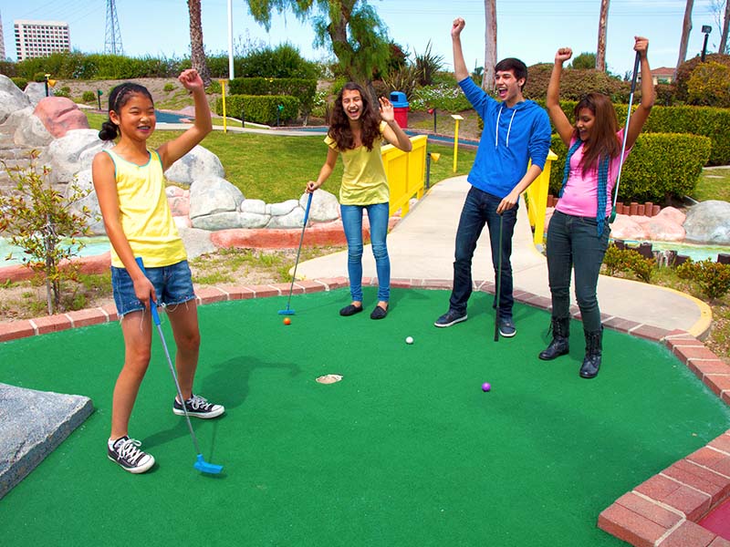 Group playing miniature golf